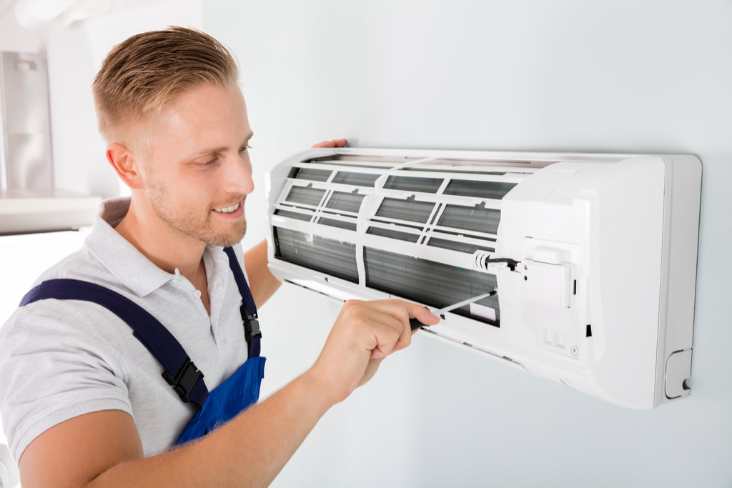 HVAC technician maintaining a ductless air conditioner in Petaluma