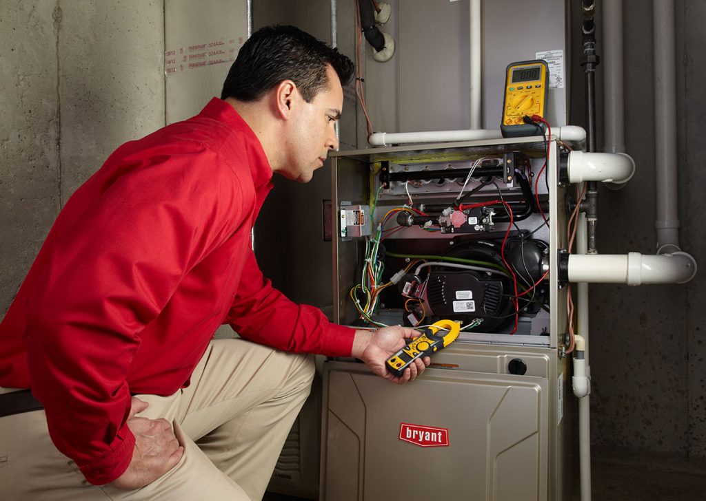 Heating technician diagnosing a furnace repair in Petaluma