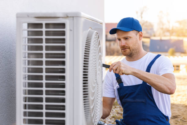 HVAC technician servicing an outdoor air conditioner in Petaluma